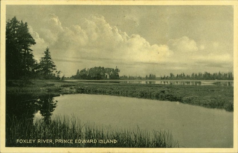 A black-and-white postcard of Foxley River. Two bodies of water are separated by a field. 