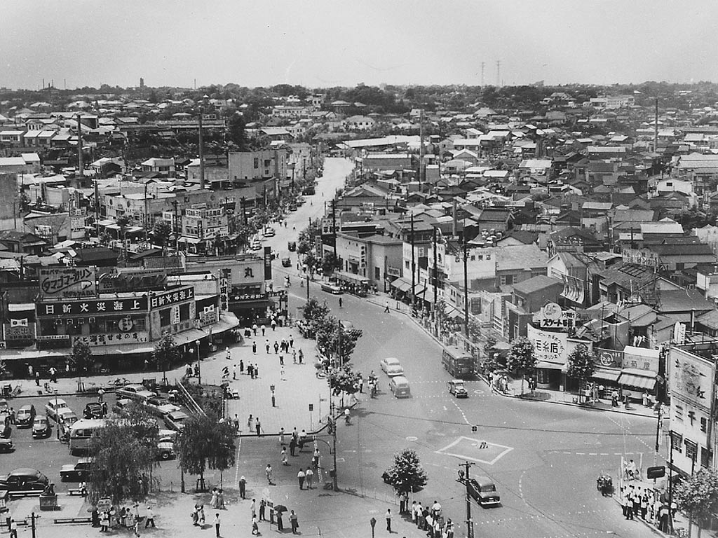 Black-and-white photograph of a Tokyo cityscape near Shinjuku Station in 1952.