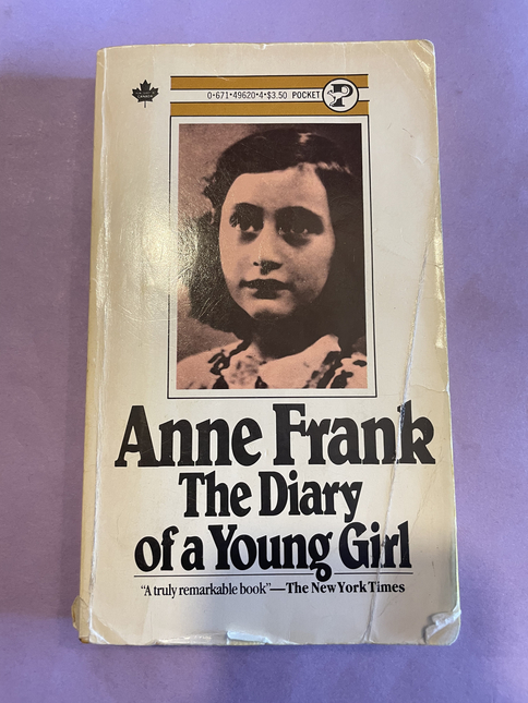 Book cover of Diary of a Young Girl on a purple background 