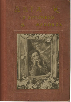 Cloth book cover of Ania z Zielonego Wzgórza with pastedown picture. Anne is looking out of a window and is surrounded by leaves and flowers.