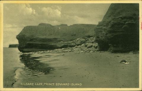 Black-and-white postcard of Kildare Cape. The shoreline is toward the left of the image with cliffs on the right. 