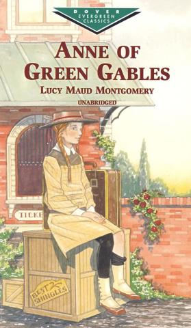 Book cover of Anne of Green Gables painted in muted tones. Anne sits on a pile of shingles with her luggage beside her.
