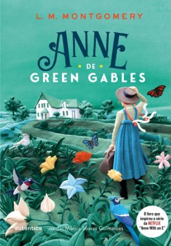 Book cover of a Brazilian edition of Anne de Green Gables with an illustration crafted with air-dry clay. Anne is surrounded by flowers, hummingbirds, and butterflies.