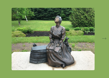 A life-sized bronze statue of L.M. Montgomery entitled A Glimpse of Beauty in Montgomery Park in Cavendish, Prince Edward Island. Conceptual Design by Grace Curtis. Sculpture and Casting by Nathan Scott. Photo by Julie A. Sellers.