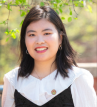 Photograph of Weiqi Tang smiling at the camera